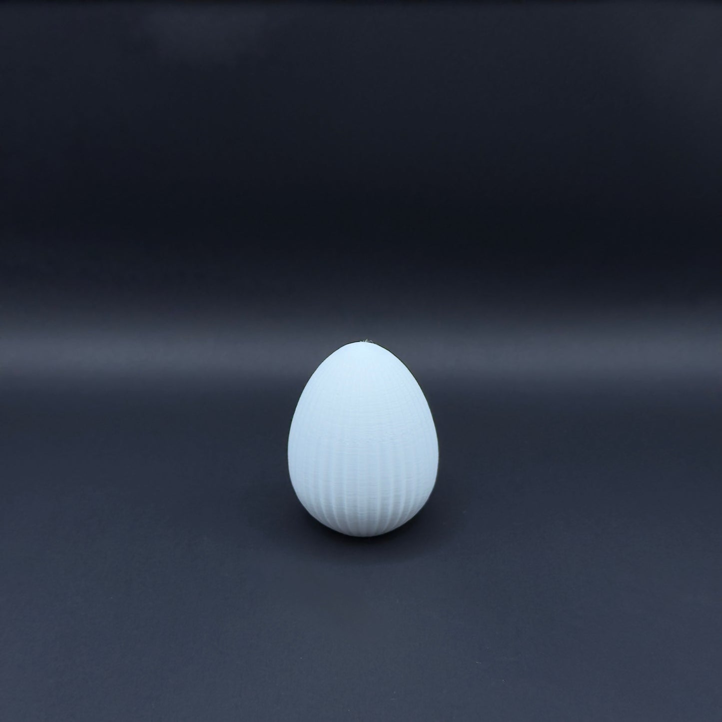 White Osterei Nordic decorative egg by MX³ Design on a neutral background.
