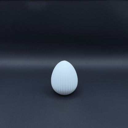 White Osterei Nordic decorative egg by MX³ Design on a neutral background.