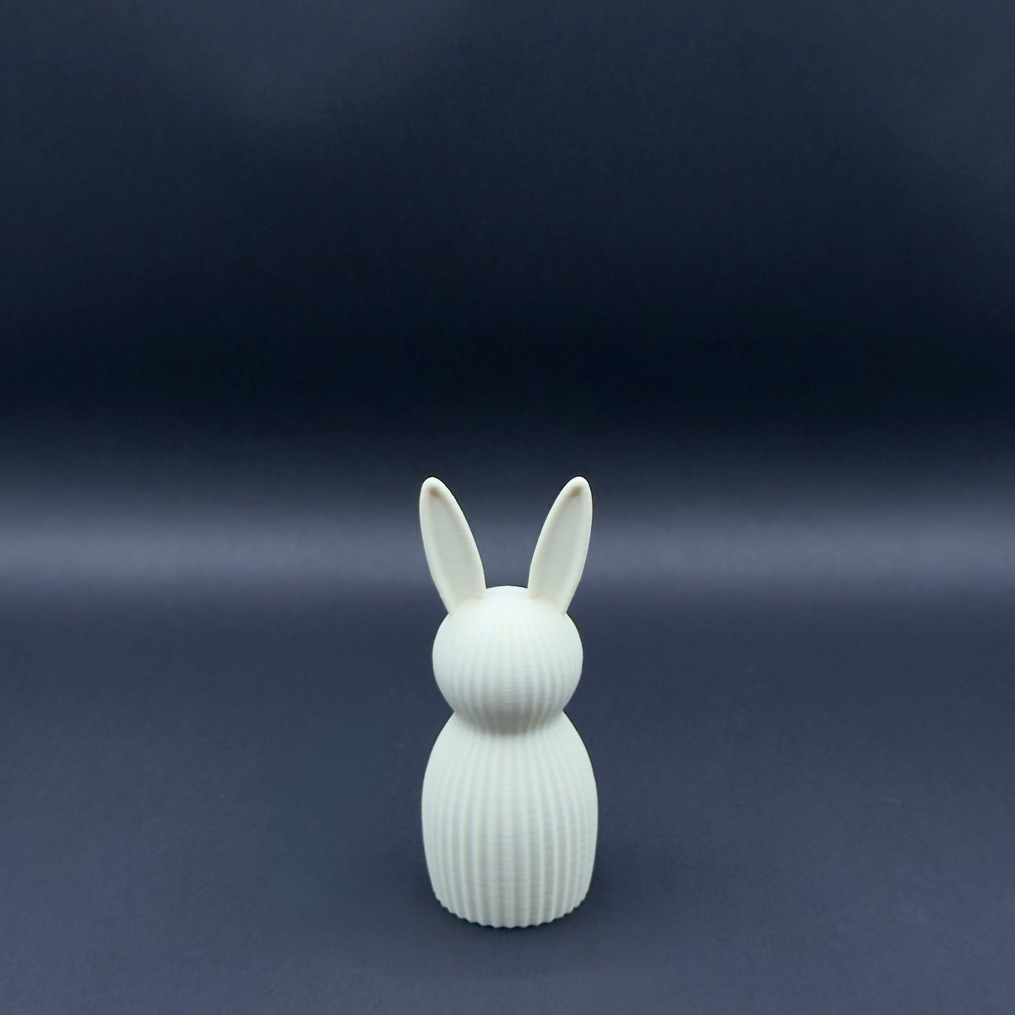 Small white Osterhase bunny figurine by MX³ Design, featuring a Nordic-inspired design and minimalist style.